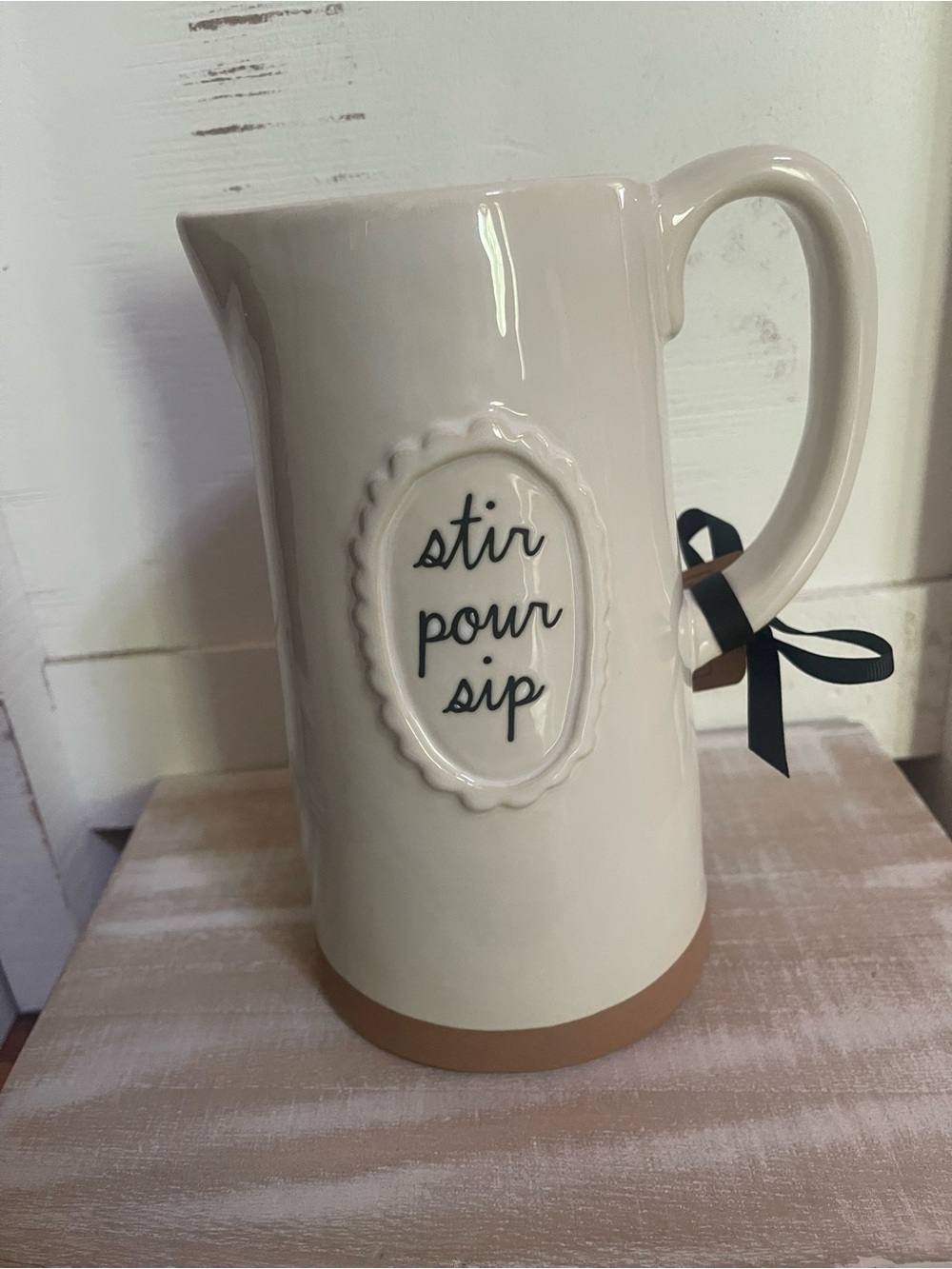Rae Dunn Ceramic Pitcher "Stir Pour Sip" - Cream with Tan Base